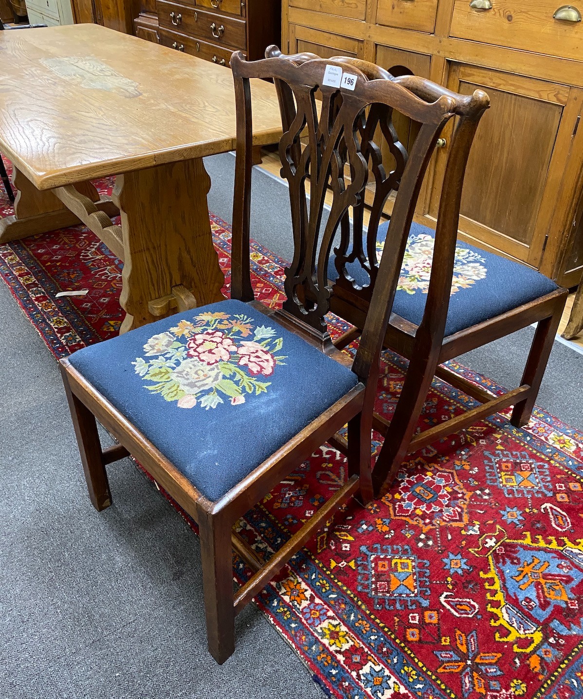 A pair of George III mahogany dining chairs with tapestry seats